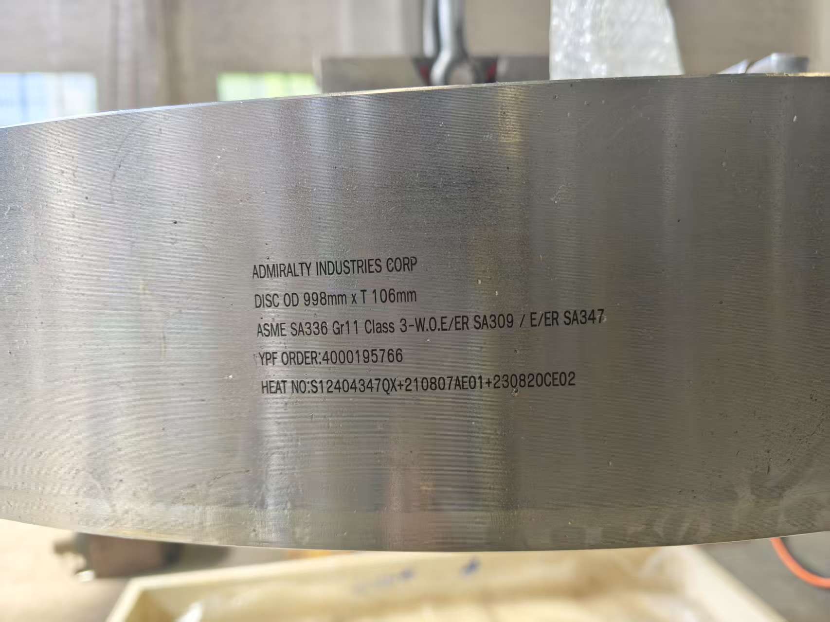 Detail of closure disk marking showing ASME material grades and full manufacturing traceability.